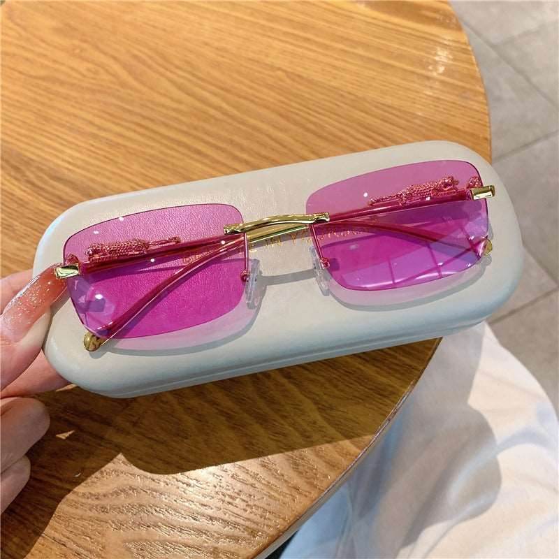 Sunglass Lover pink and gold rimless frames with magenta lenses trendy rimless sunglasses for women on white case