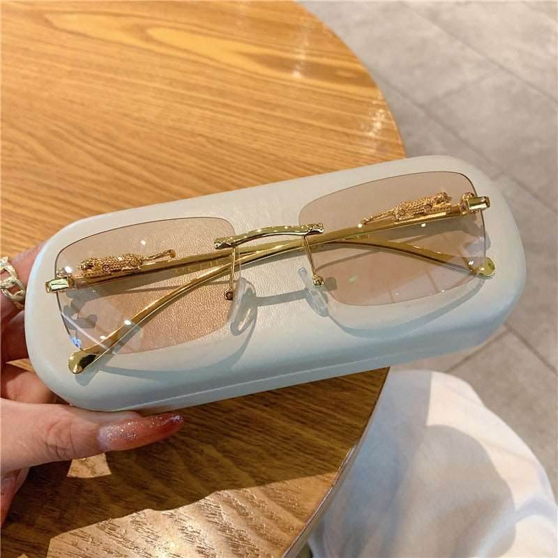 Sunglass Lover trendy rimless sunglasses for women gold metal frame pink gradient lenses on white case