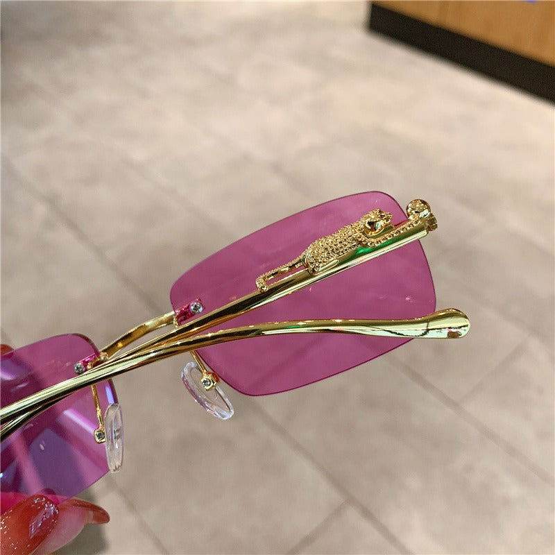 Sunglass Lover trendy rimless sunglasses for women with pink lenses gold leopard temple and clear nose pads