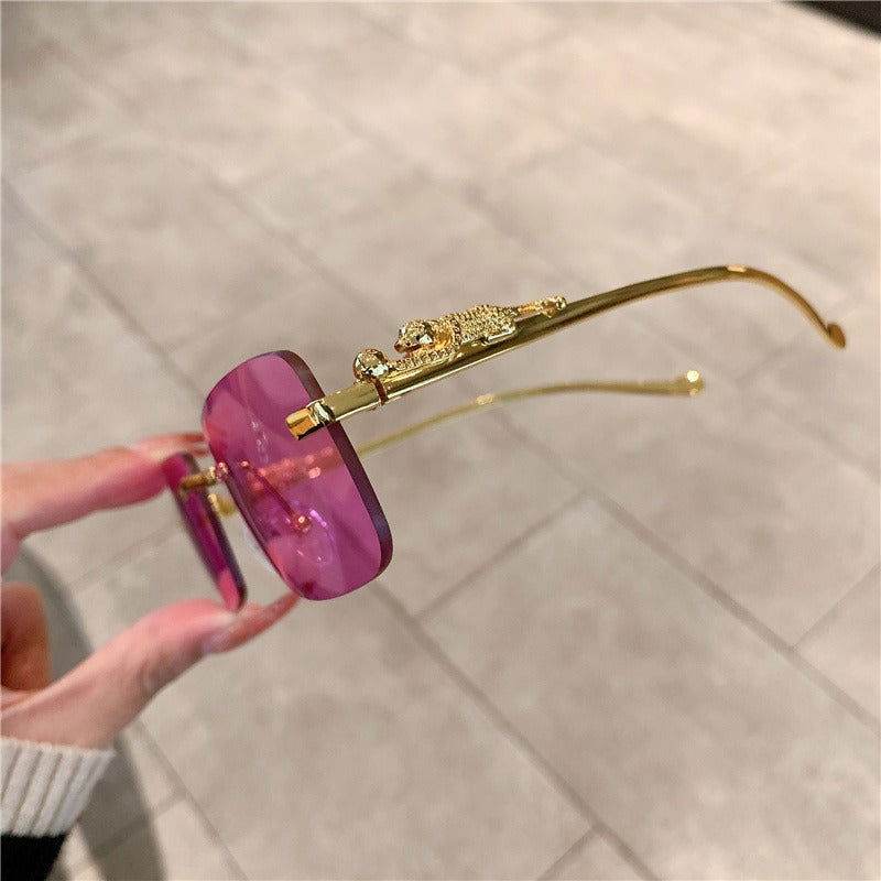 Pink purple lens trendy rimless sunglasses for women by Sunglass Lover with gold jeweled temples
