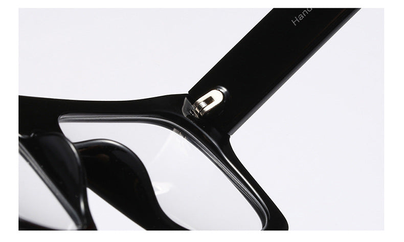 Close-up of black Sunglass Lover square eyeglasses showcasing oversized eyeglass frames detail