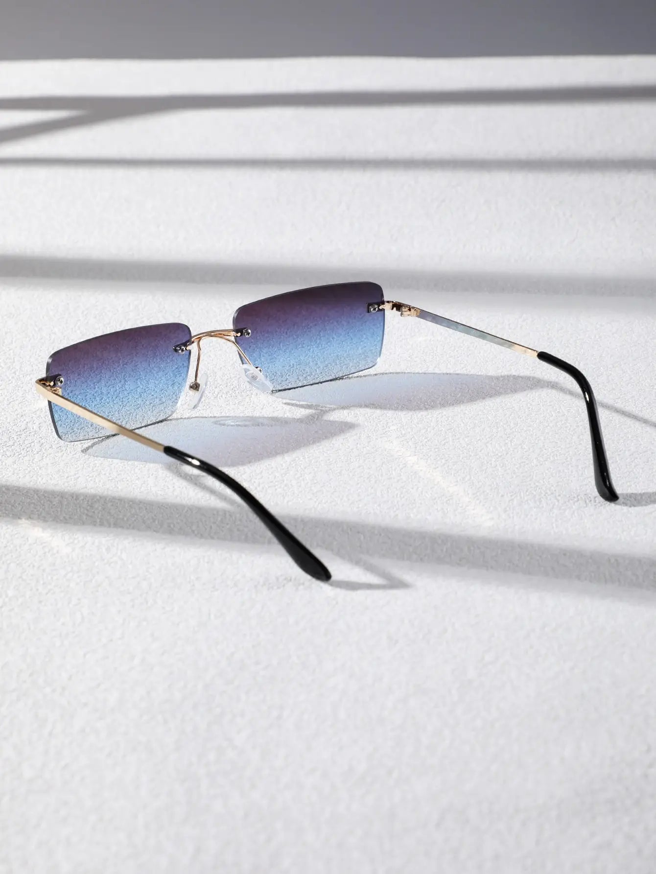 Bondex rimless sunglasses by Sunglass Lover with gradient blue lenses and gold accents