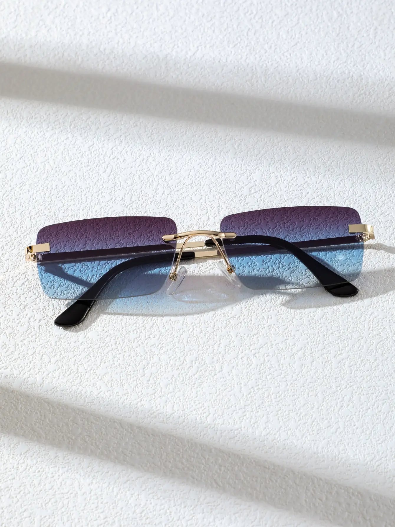 Bondex rimless sunglasses by Sunglass Lover with gradient purple and blue lenses and gold bridge