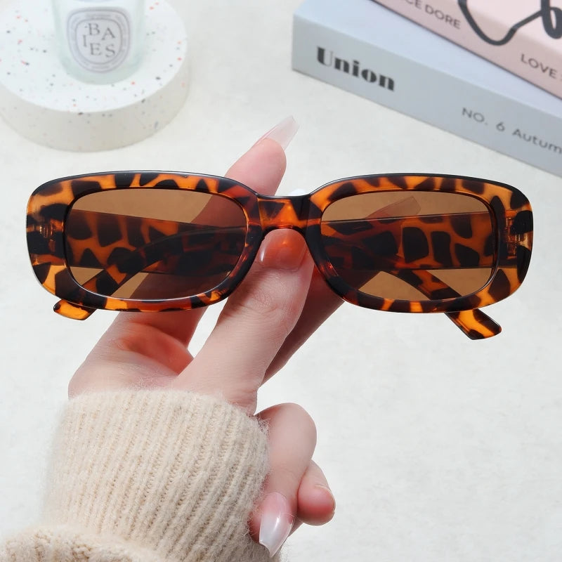 Jimmy Rectangle sunglasses by Sunglass Lover with tortoiseshell frame and brown lenses held in hand