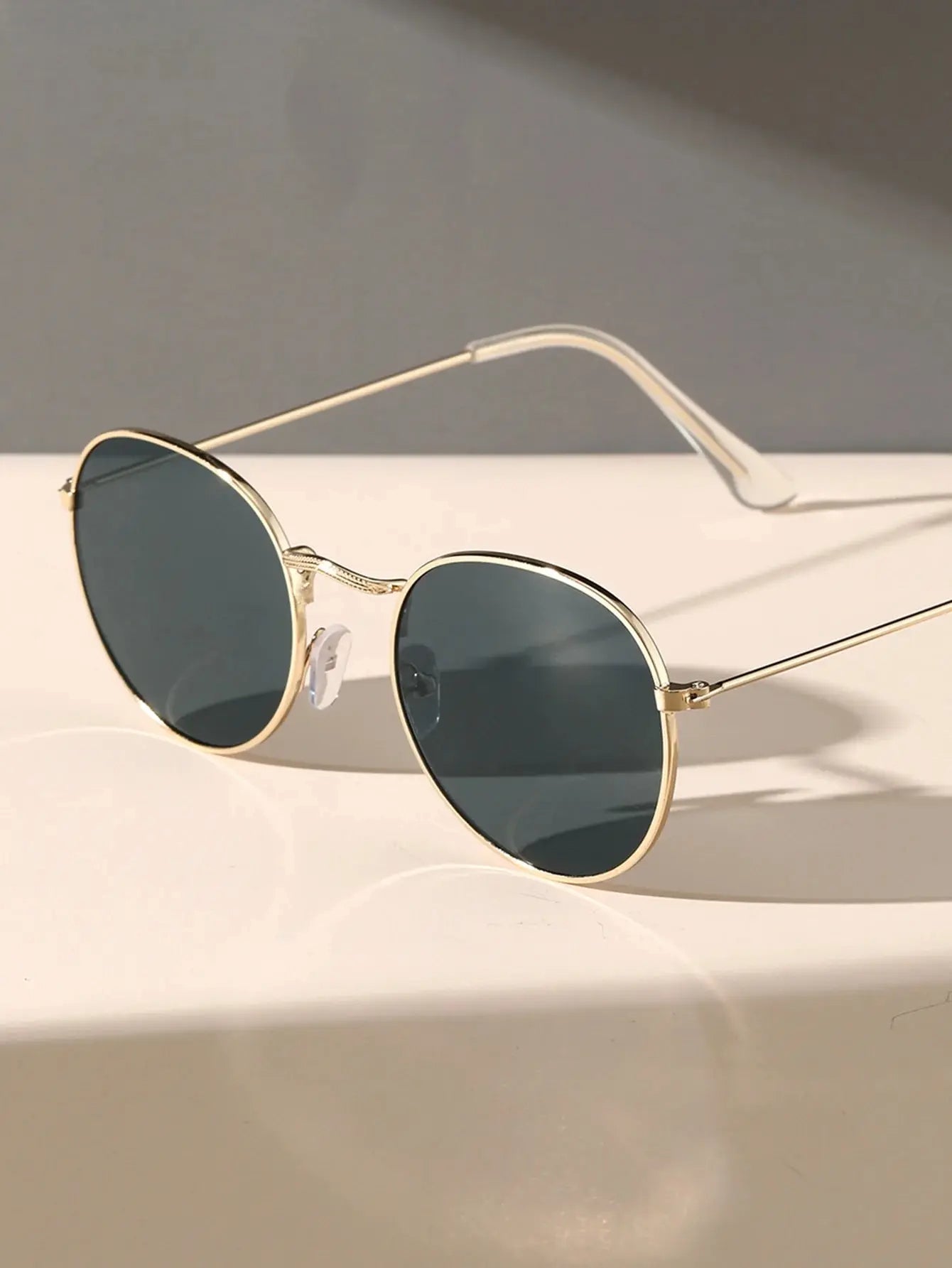 Oval sunglasses for men by Sunglass Lover with gold frame and dark lenses