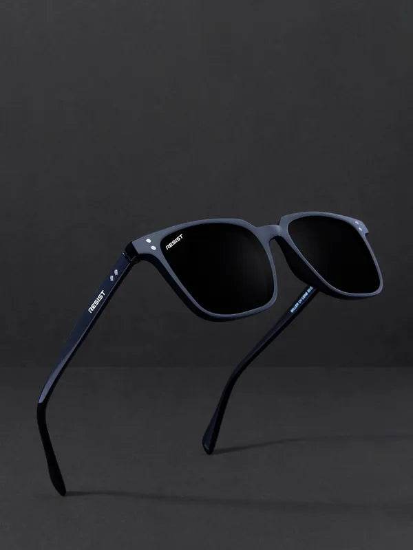 Sunglass Lover small black rectangle sunglasses with matte black frame and dark lenses on charcoal backdrop