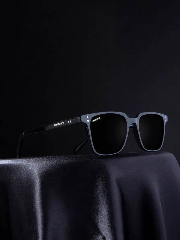 Sunglass Lover small black rectangle sunglasses displayed on draped fabric with UV protection