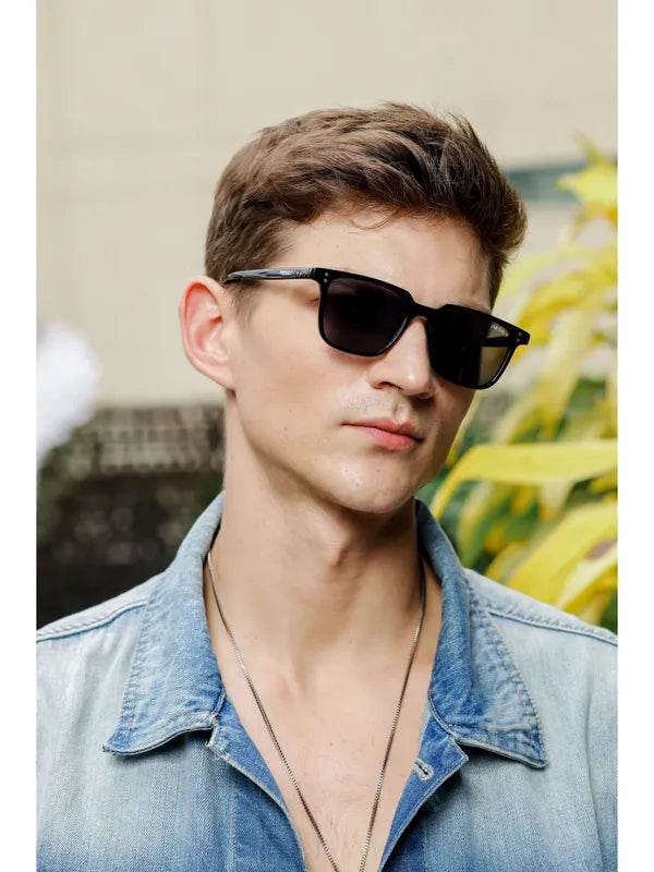 Sunglass Lover small black rectangle sunglasses on male model with denim jacket and layered necklaces