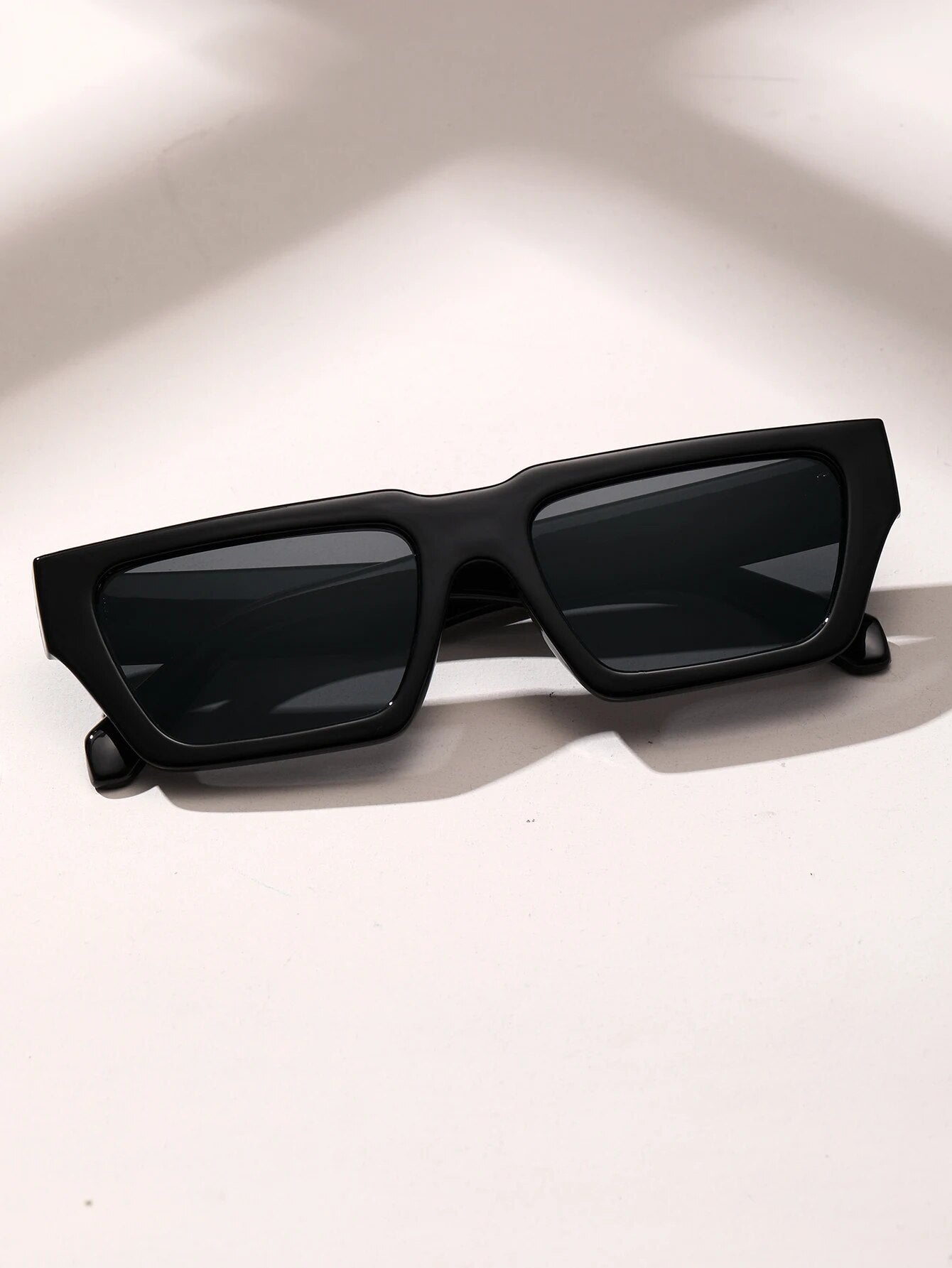Black square sunglasses for men by Sunglass Lover with rectangular frame and dark lenses