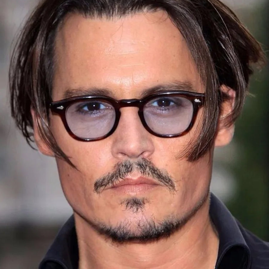 Sunglass Lover vintage rivet round sunglasses with dark frames and tinted lenses worn by a man