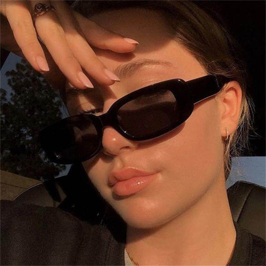 Sunglass Lover black glossy small rectangle sunglasses for women worn in closeup sunlit selfie