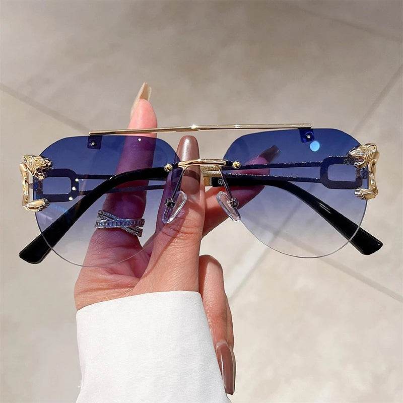 Sunglass Lover pilot sunglasses with blue gradient lenses and gold accents held in hand retro aviator sunglasses for men and women