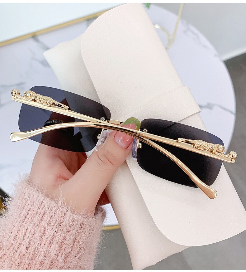 Sunglass Lover rimless sunglasses for men with black lenses and gold decorative temples