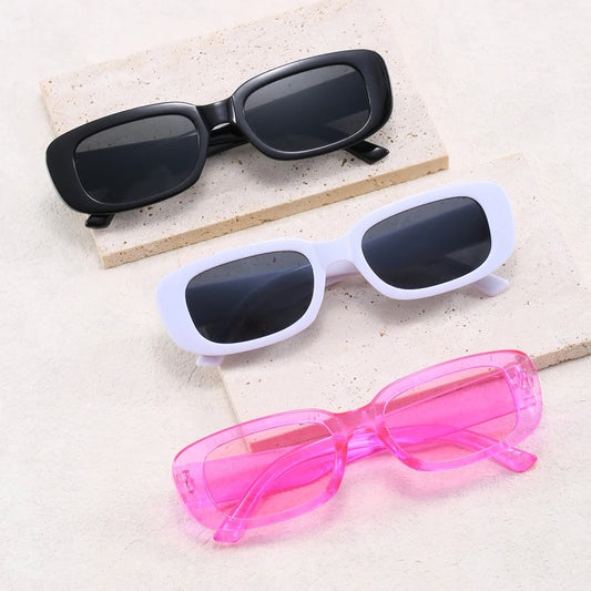 Jimmy Rectangle sunglasses in black, white, and pink frames by Sunglass Lover displayed on stone tiles
