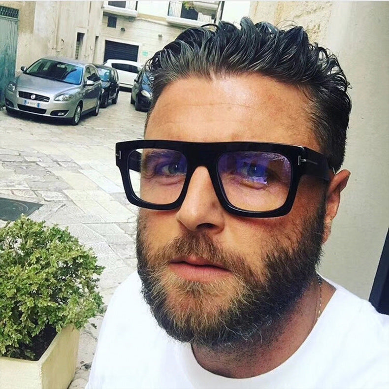 Man wearing oversized eyeglass frames square eyeglasses by Sunglass Lover outdoors