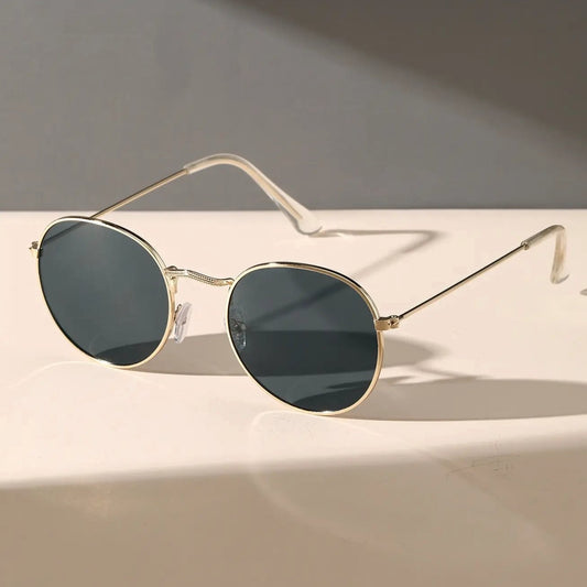 Round sunglasses with gold frames and dark lenses from Sunglass Lover oval sunglasses for men
