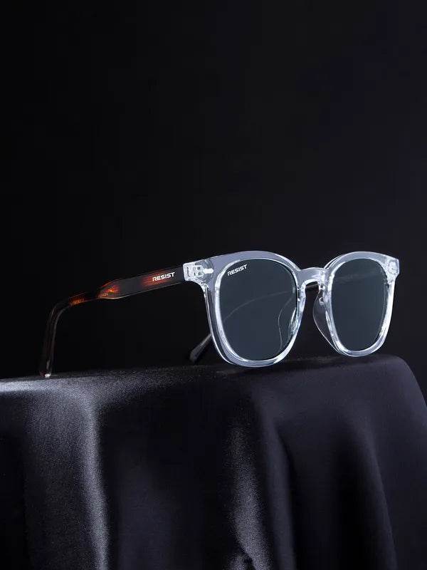 Sunglass Lover square clear frame sunglasses with dark lenses and tortoise temples on black drape black oval sunglasses for men