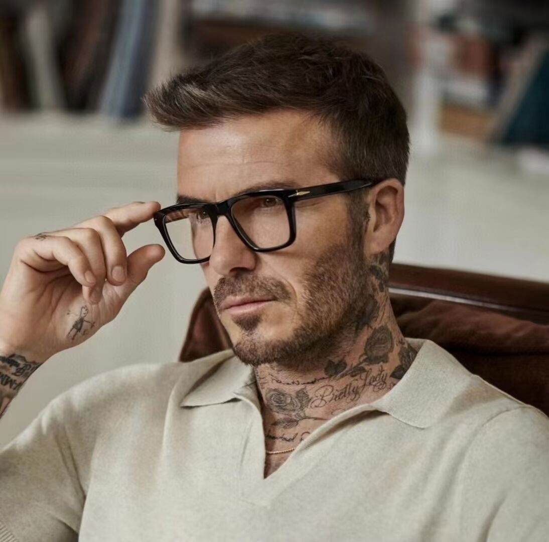 Sunglass Lover COM antiblue black square eyeglasses on male model with thick black frames and clear lenses