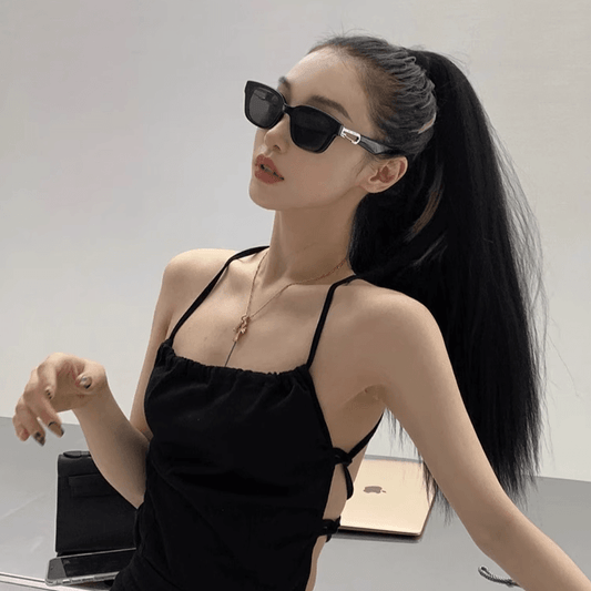 Sunglass Lover black rectangle frame retro cat eye sunglasses for women worn by model with ponytail