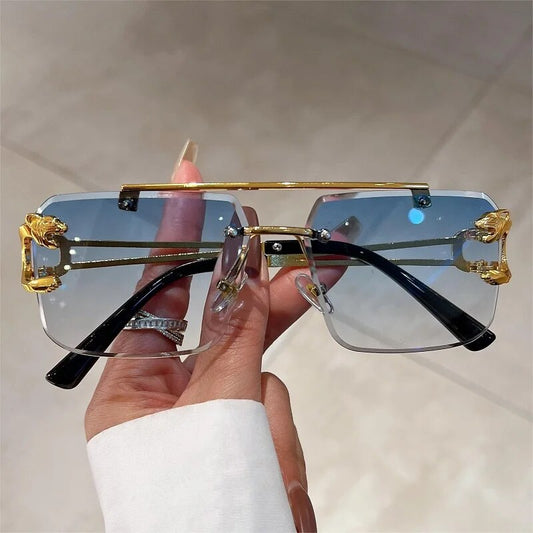 Jim Jack double bridge sunglasses rimless design with gold accents and blue gradient lenses from Sunglass Lover