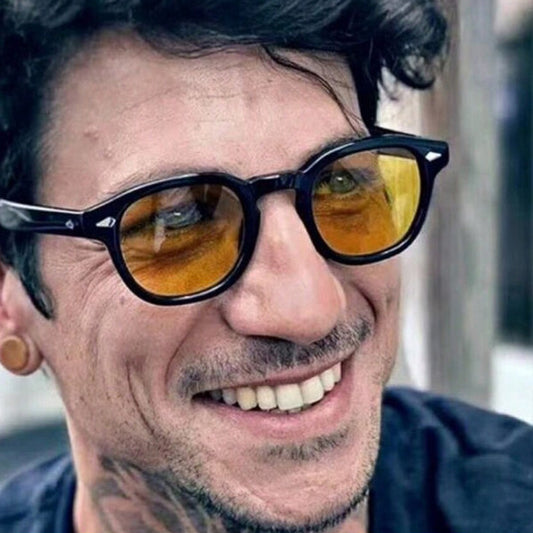 Man wearing vintage rivet round sunglasses with black frame and yellow lenses by Sunglass Lover